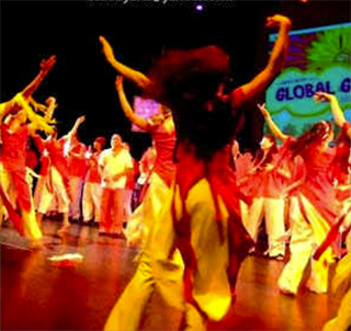 Image of dancers on stage, mid-performance