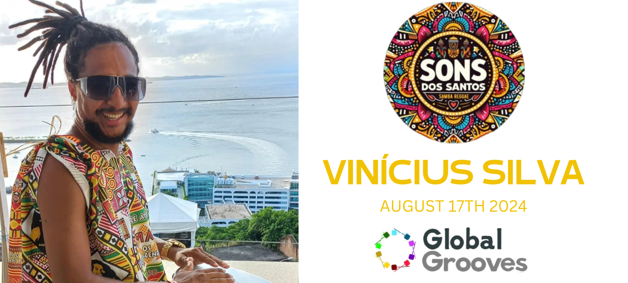 Vinicius, workshop leader and percussionist, playing a drum overlooking a beach