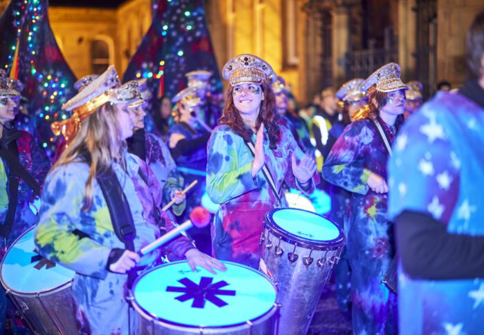 An LED drummer playing in a Carnival