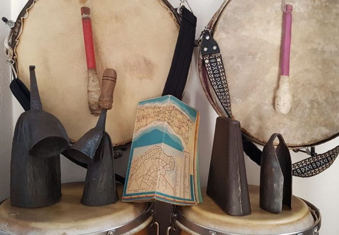picture of various Cuban drums and a map