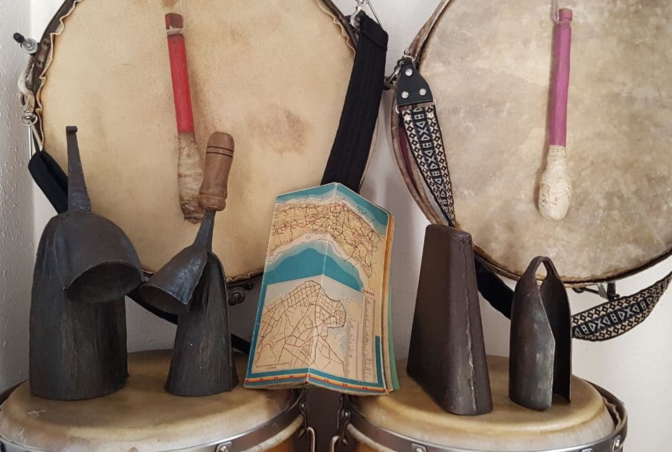 picture of various Cuban drums and a map